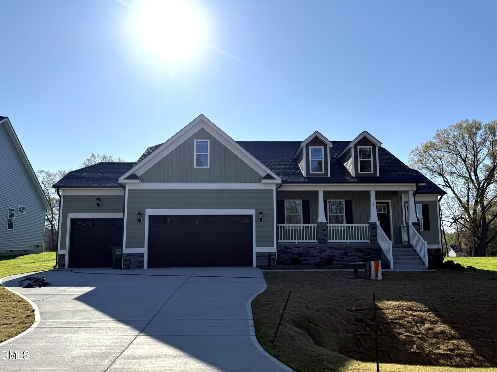 70 Hot Spgs Way Benson, NC 27504 - Photo 1 of 29 a front view of a house with garden