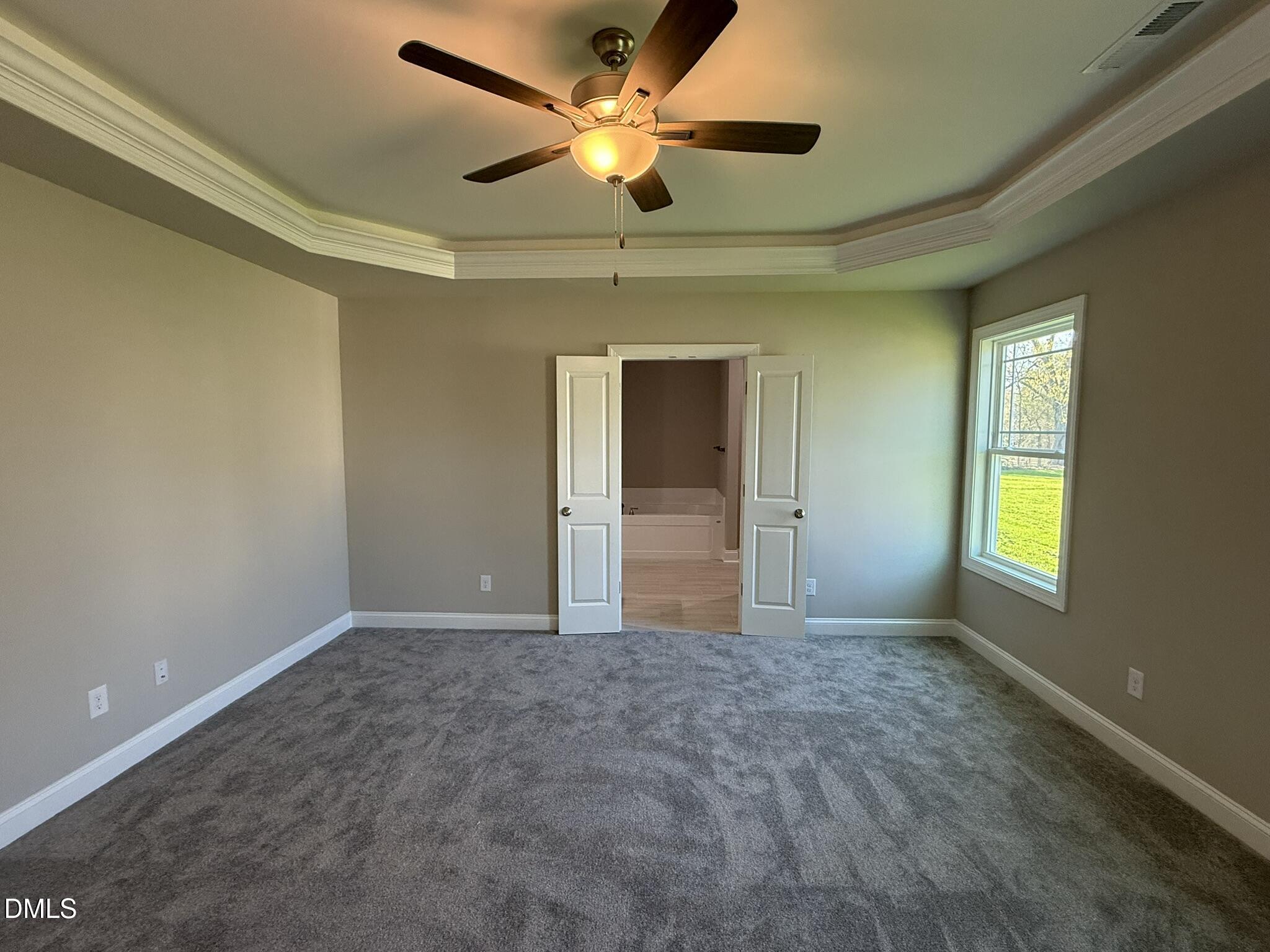 70 Hot Spgs Way Benson, NC 27504 - Photo 11 of 29 a view of an empty room and window