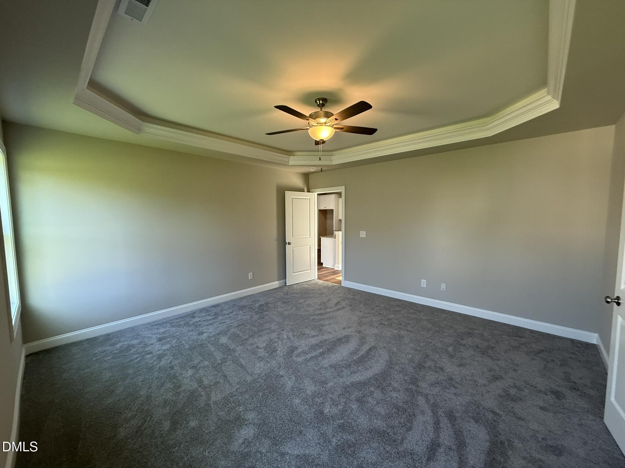 70 Hot Spgs Way Benson, NC 27504 - Photo 12 of 29 an empty room and a chandelier fan