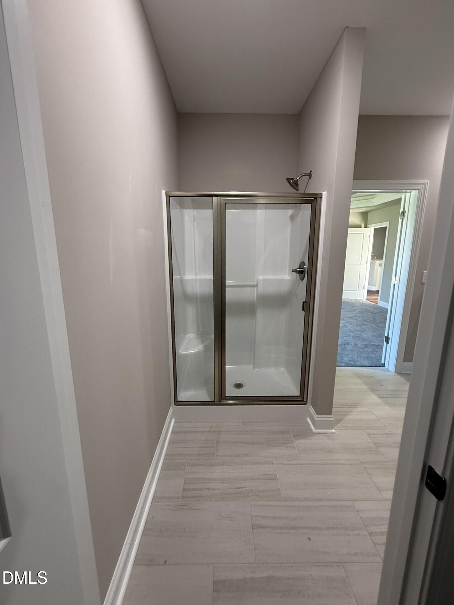 70 Hot Spgs Way Benson, NC 27504 - Photo 15 of 29 an empty room with mirror gate