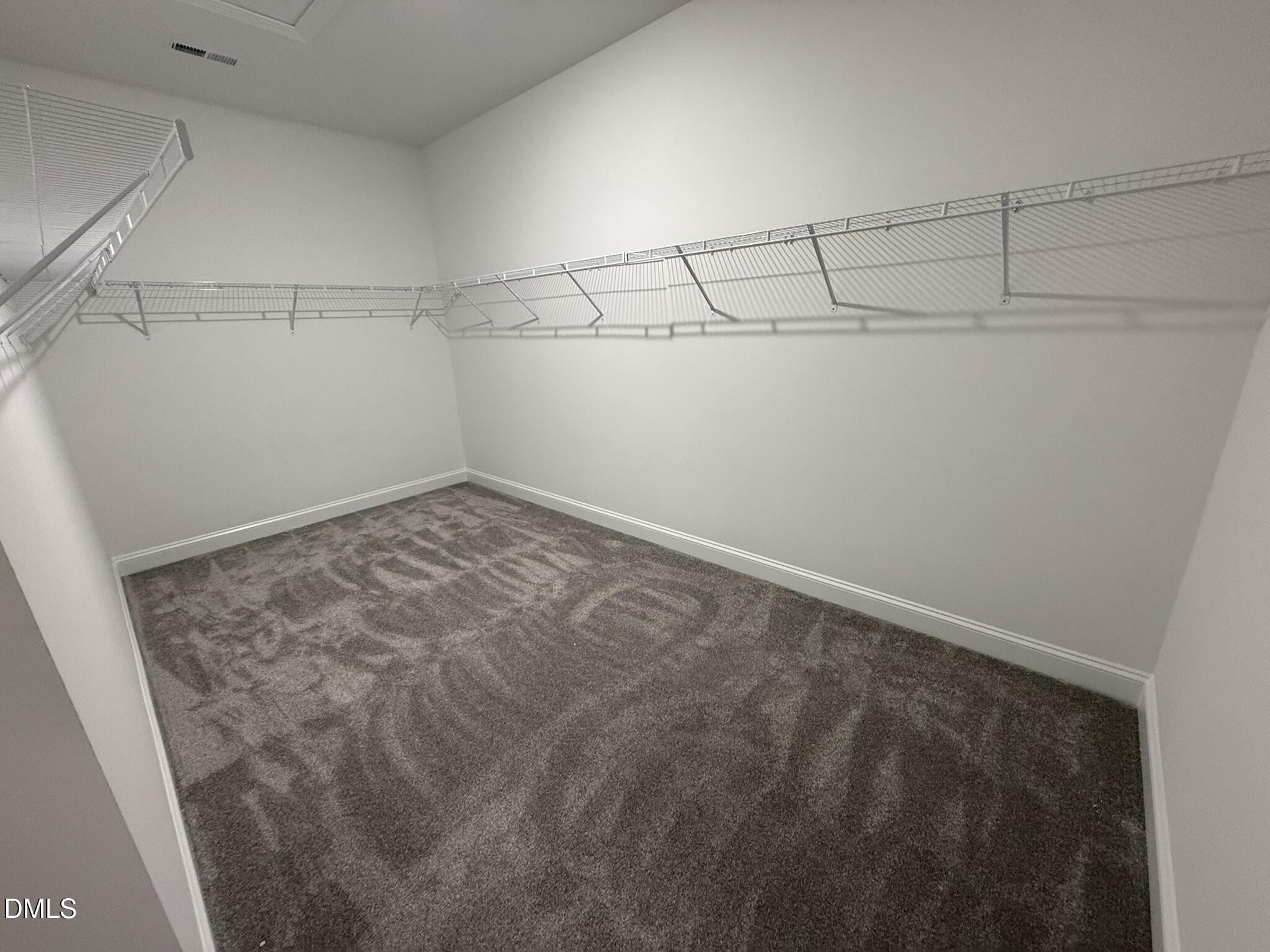 70 Hot Spgs Way Benson, NC 27504 - Photo 16 of 29 a view of a room with racks on the wall