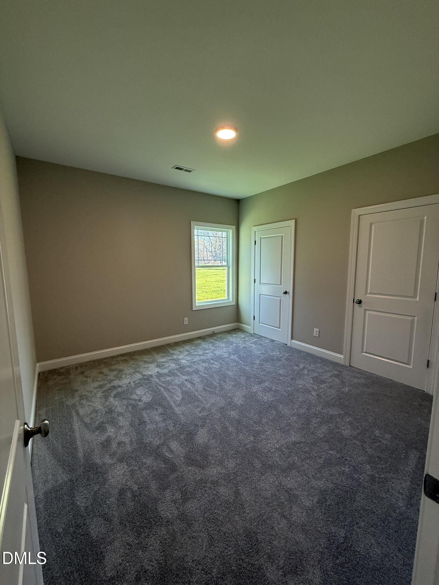 70 Hot Spgs Way Benson, NC 27504 - Photo 20 of 29 a view of an empty room and window