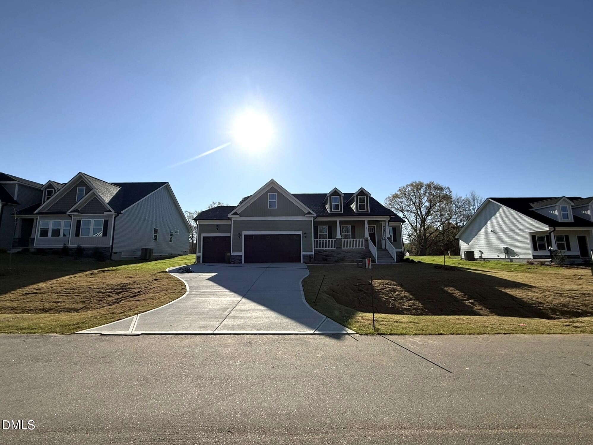 70 Hot Spgs Way Benson, NC 27504 - Photo 2 of 29 a front view of a house with yard