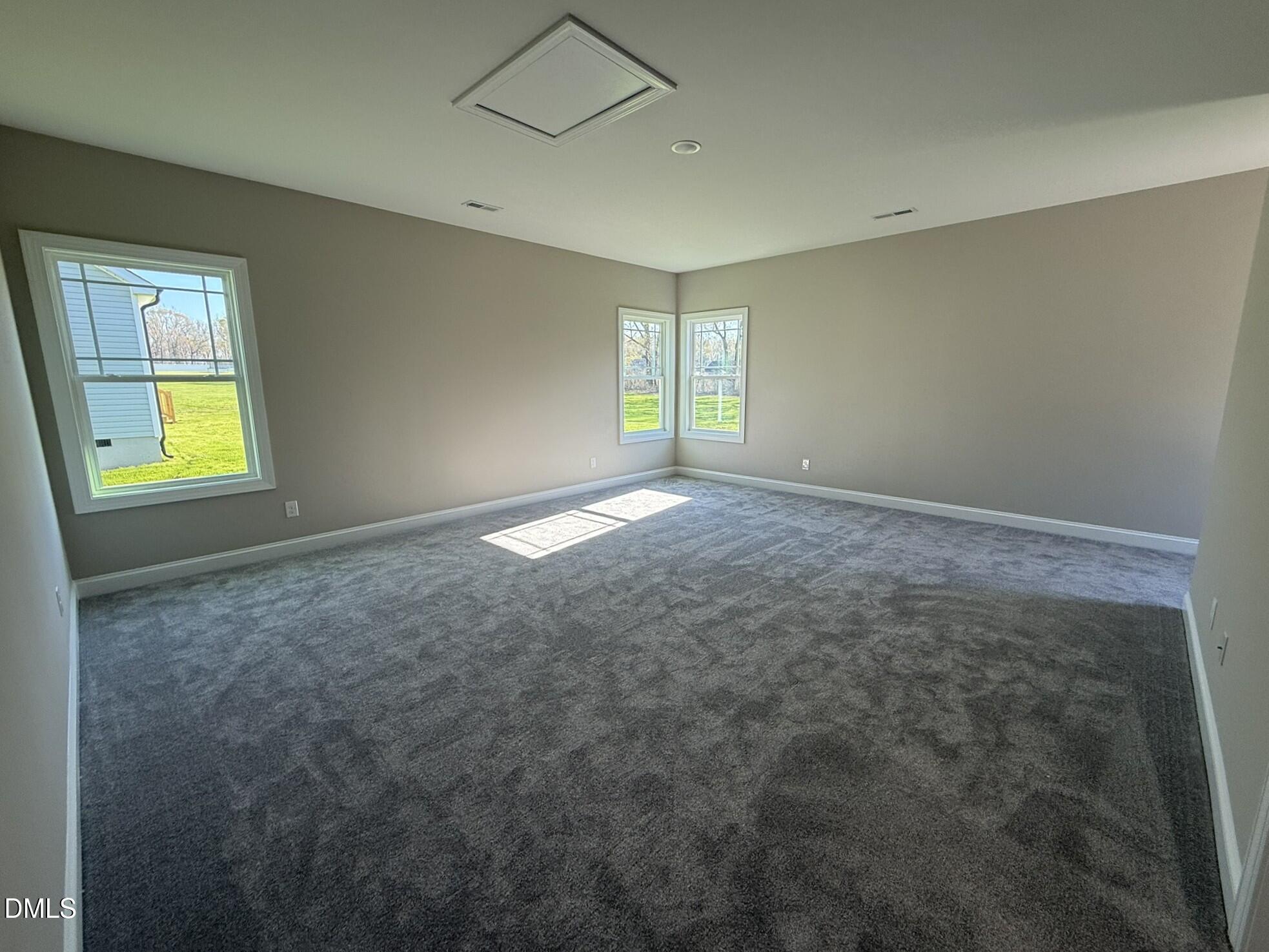 70 Hot Spgs Way Benson, NC 27504 - Photo 22 of 29 a view of an empty room with a window