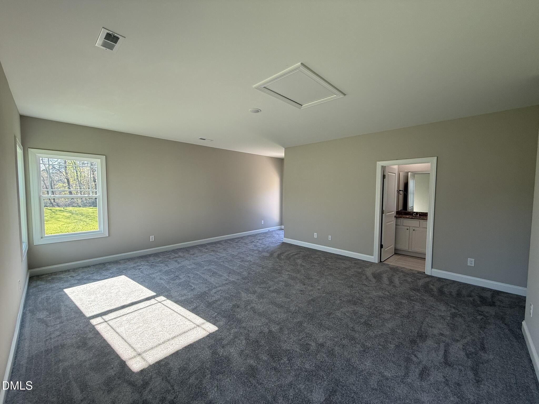 70 Hot Spgs Way Benson, NC 27504 - Photo 23 of 29 an empty room with windows and cabinet