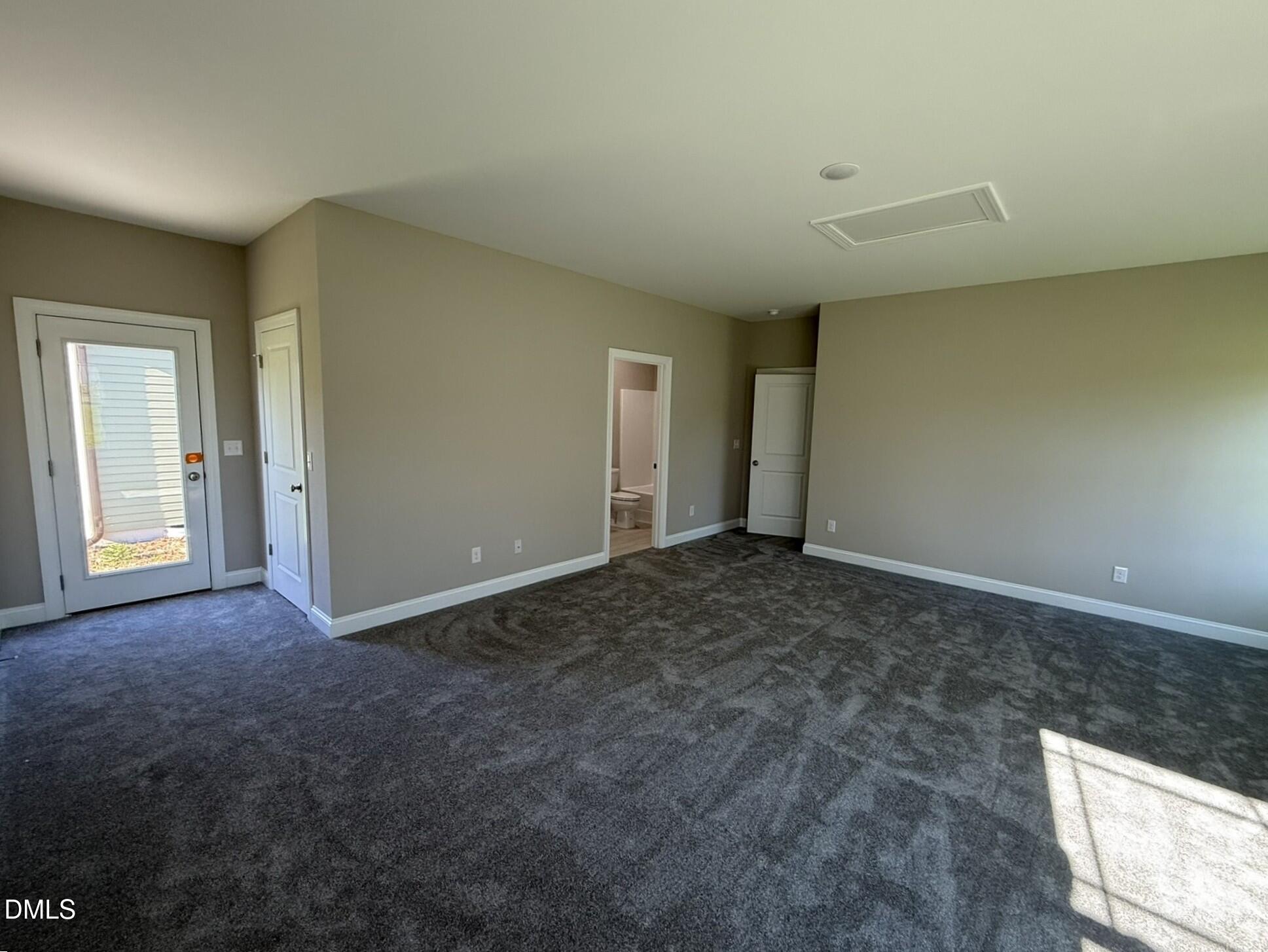 70 Hot Spgs Way Benson, NC 27504 - Photo 24 of 29 an empty room with a natural light