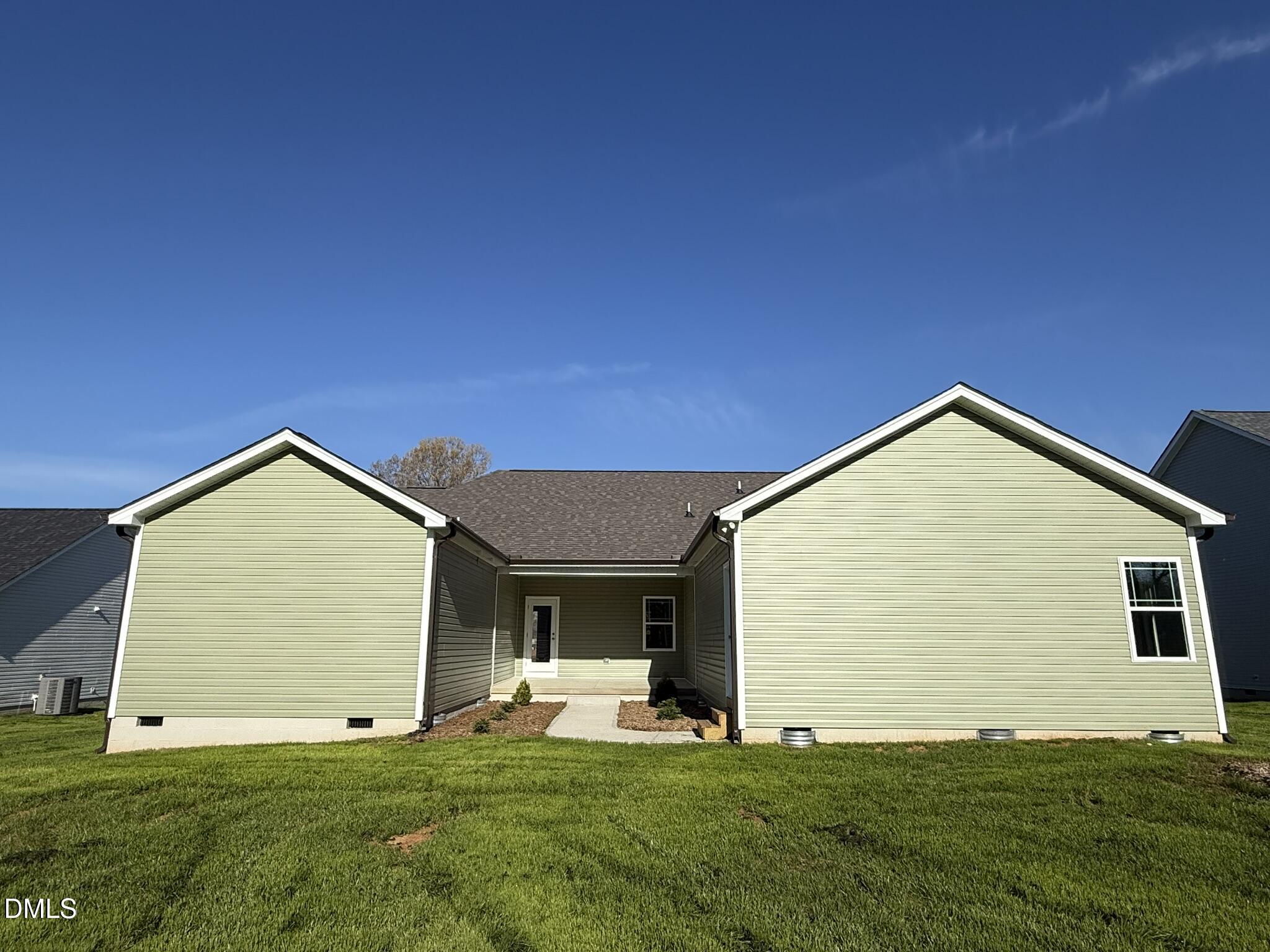 70 Hot Spgs Way Benson, NC 27504 - Photo 28 of 29 a view of a house with yard and garage
