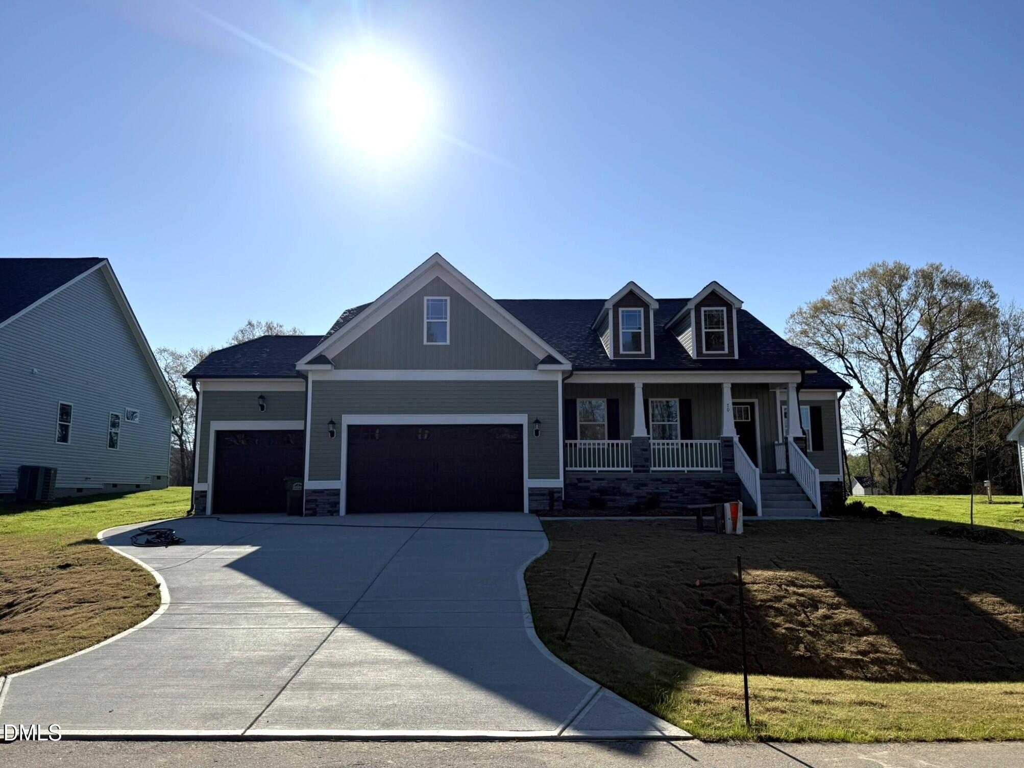 70 Hot Spgs Way Benson, NC 27504 - Photo 3 of 29 a front view of a house with a yard