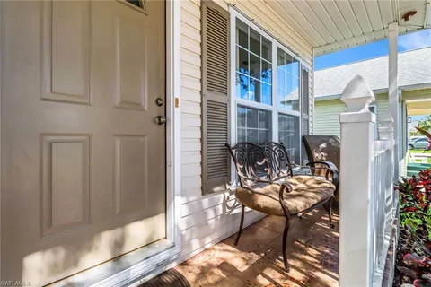 a balcony view with a seating space