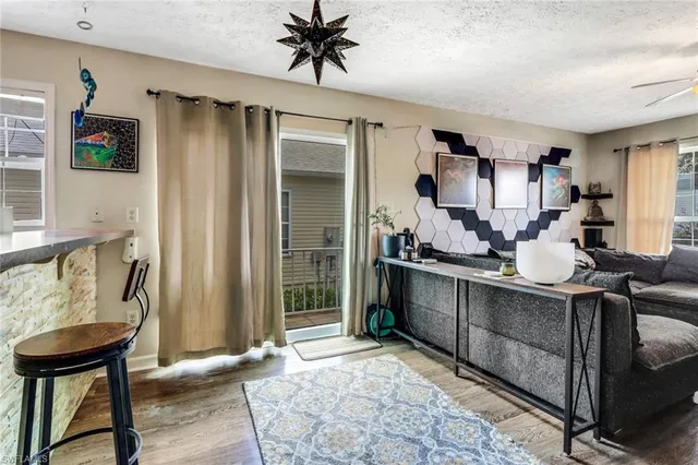 a kitchen with stainless steel appliances granite countertop a sink and a refrigerator