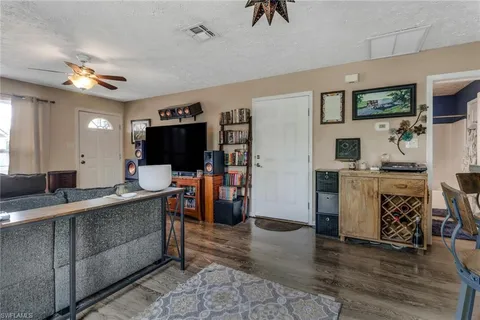 a view of a living room and a flat screen tv