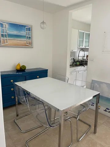 a table that has a table and chairs in it