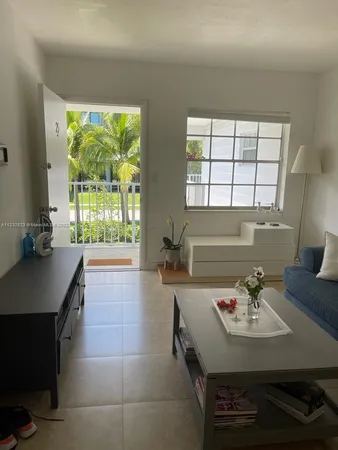 a kitchen with a sink appliances and a large window