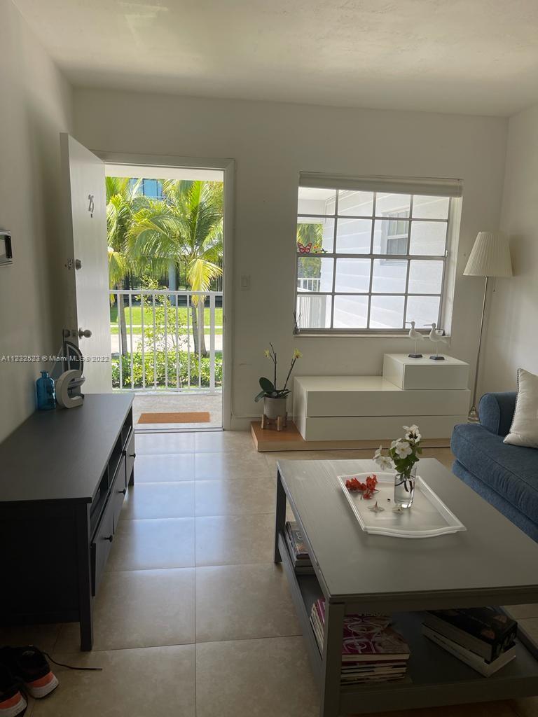 100 Sunrise Drive, Unit 25 Key Biscayne, FL 33149 - Photo 3 of 21 a kitchen with a sink appliances and a large window