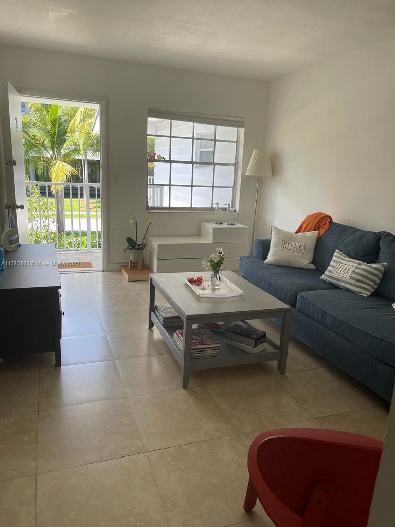 100 Sunrise Drive, Unit 25 Key Biscayne, FL 33149 - Photo 6 of 21 a living room with furniture and a window