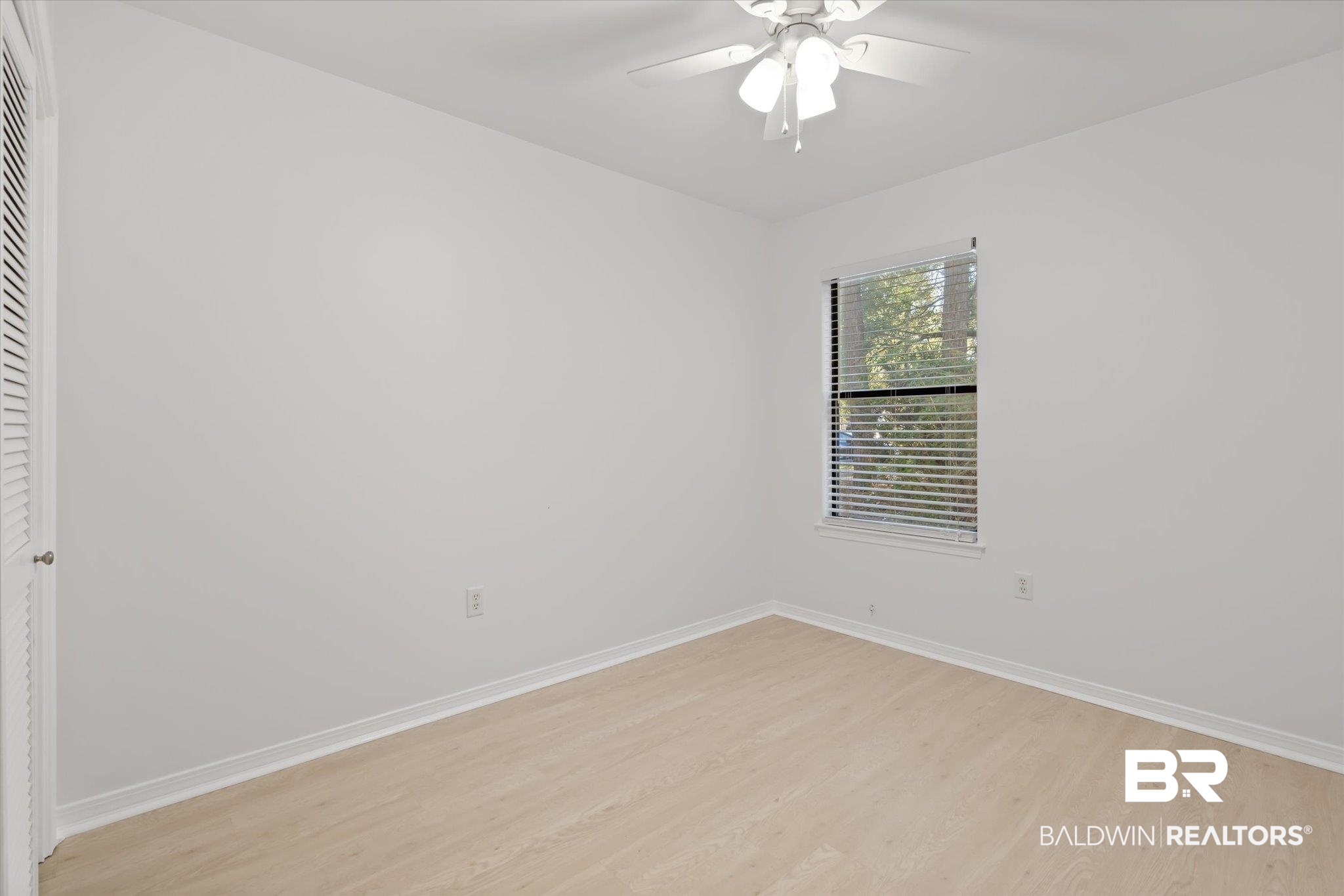 1008 Mcneil Avenue Mobile, AL 36609 - Photo 15 of 20 Empty room with ceiling fan and light wood-type flooring
