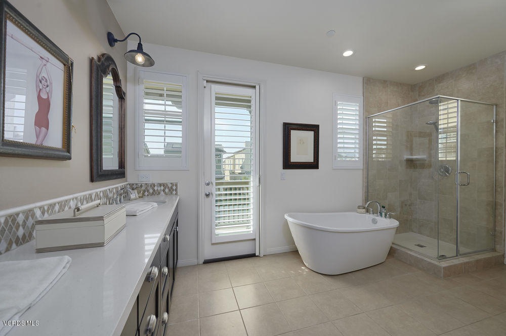 372 Calistoga Road Camarillo, CA 93010 - Photo 20 of 36 a bathroom with a tub a window and a shower
