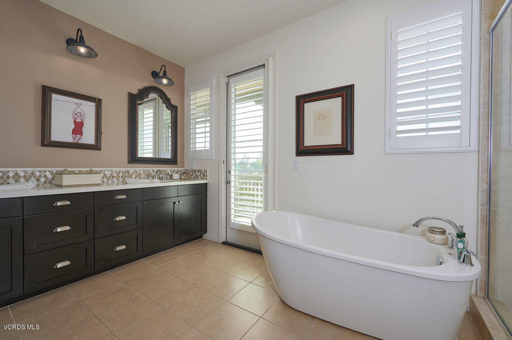 372 Calistoga Road Camarillo, CA 93010 - Photo 22 of 36 a bathroom with a tub a sink double vanity and a window