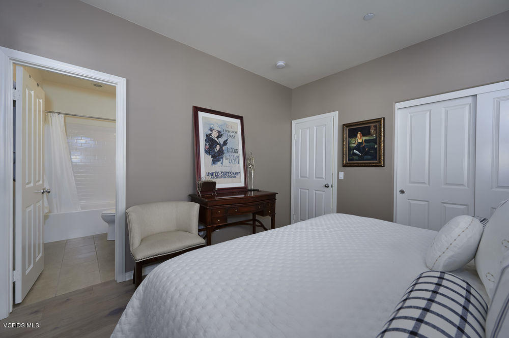 372 Calistoga Road Camarillo, CA 93010 - Photo 25 of 36 a bedroom with a bed and a lamp