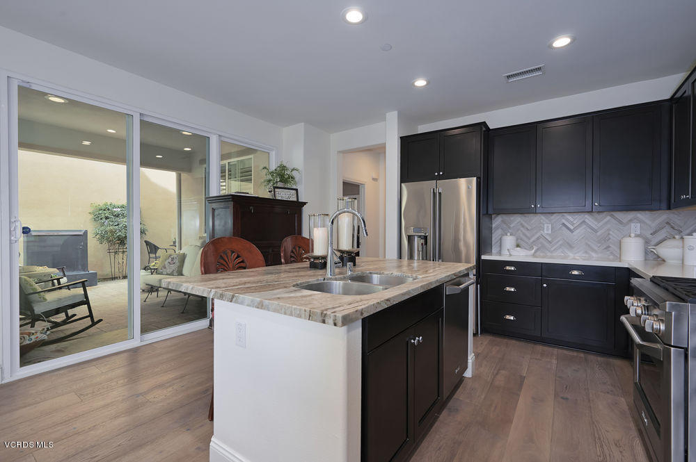 372 Calistoga Road Camarillo, CA 93010 - Photo 7 of 36 a kitchen with stainless steel appliances granite countertop a sink stove and refrigerator