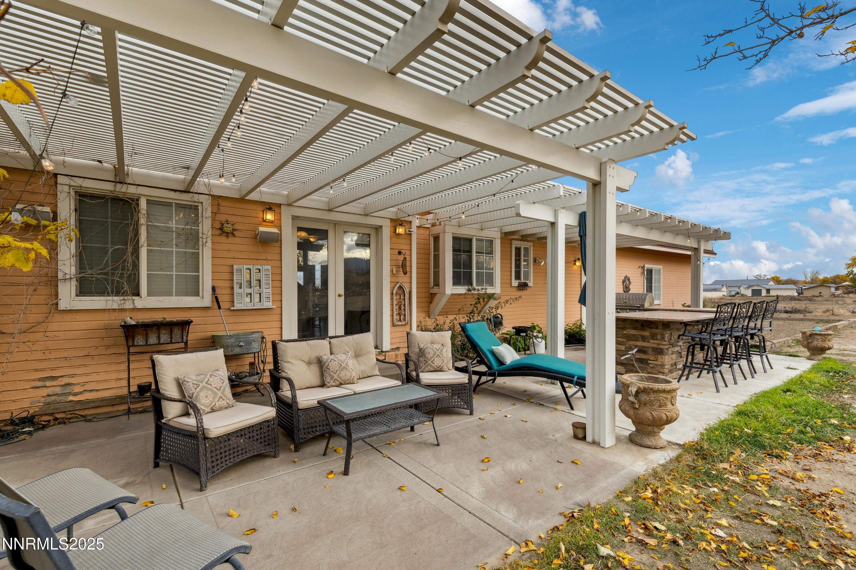 955 Carol Way Fernley, NV 89408 - Photo 11 of 42 a patio with patio couch and table