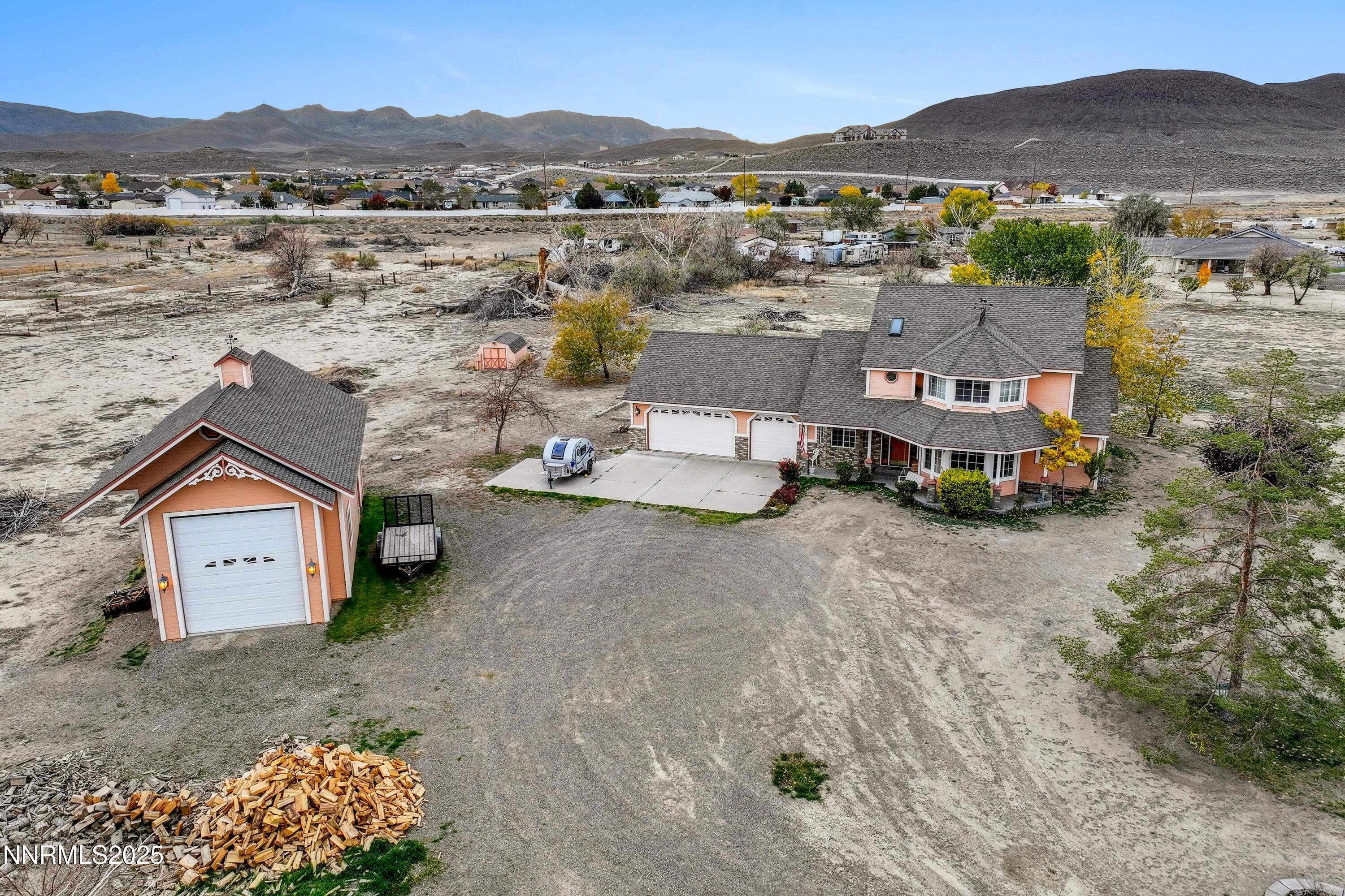 955 Carol Way Fernley, NV 89408 - Photo 13 of 42 a view of a house with a mountain and a mountain view