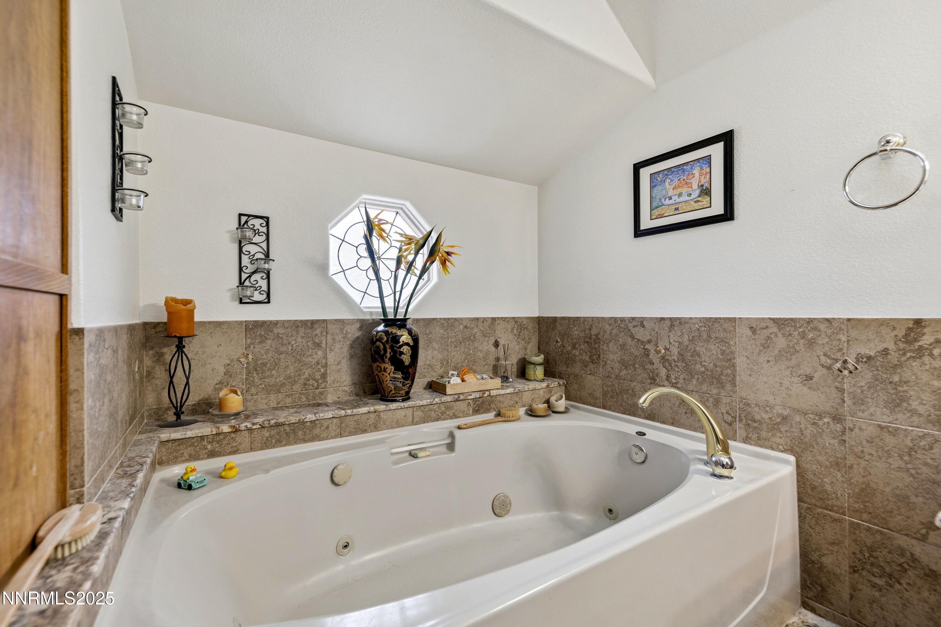 955 Carol Way Fernley, NV 89408 - Photo 19 of 42 a bathroom with a tub and a sink