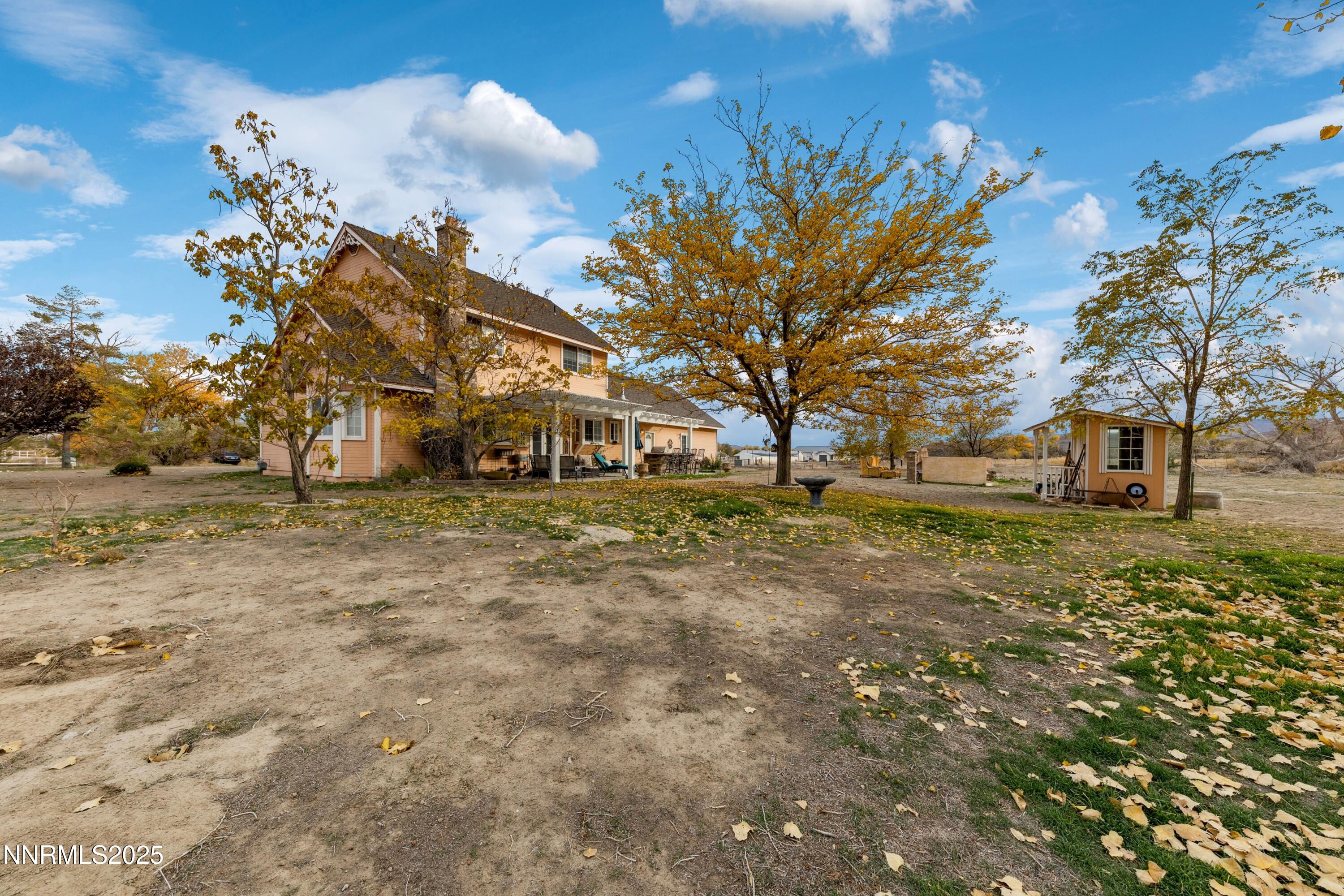 955 Carol Way Fernley, NV 89408 - Photo 2 of 42 a front view of a house with a yard