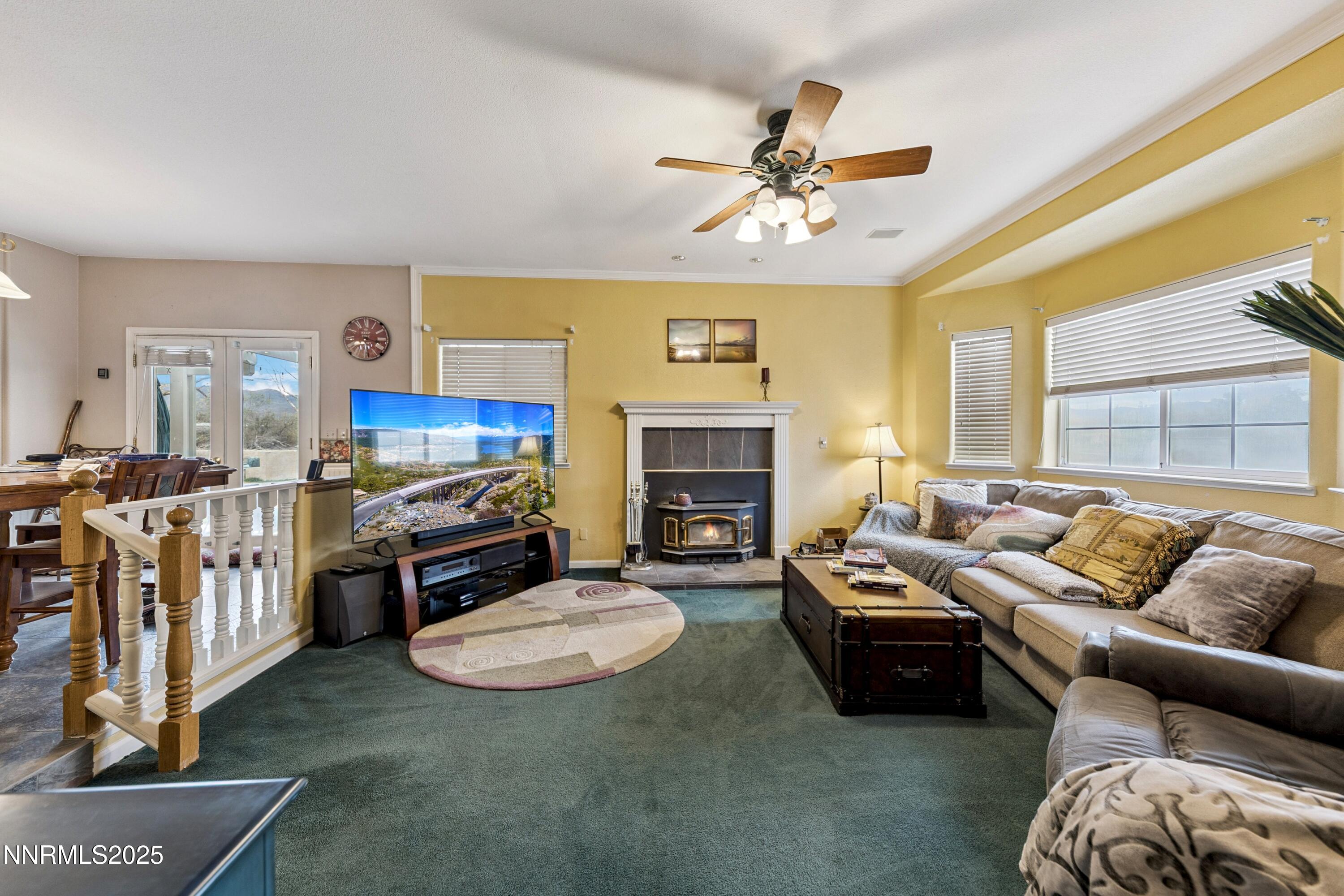 955 Carol Way Fernley, NV 89408 - Photo 30 of 42 a living room with furniture fireplace and a large window