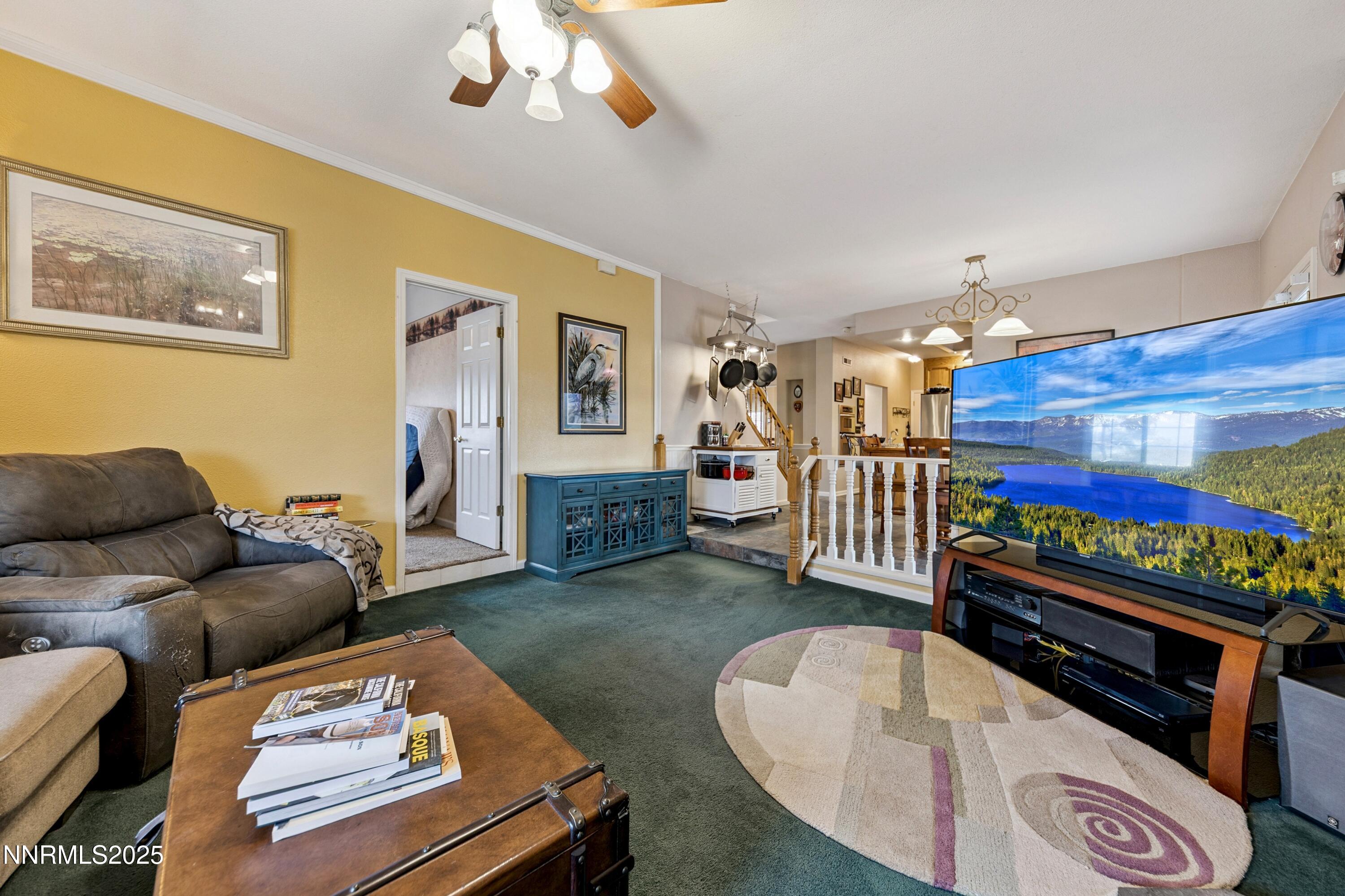 955 Carol Way Fernley, NV 89408 - Photo 31 of 42 a living room with furniture and a fireplace
