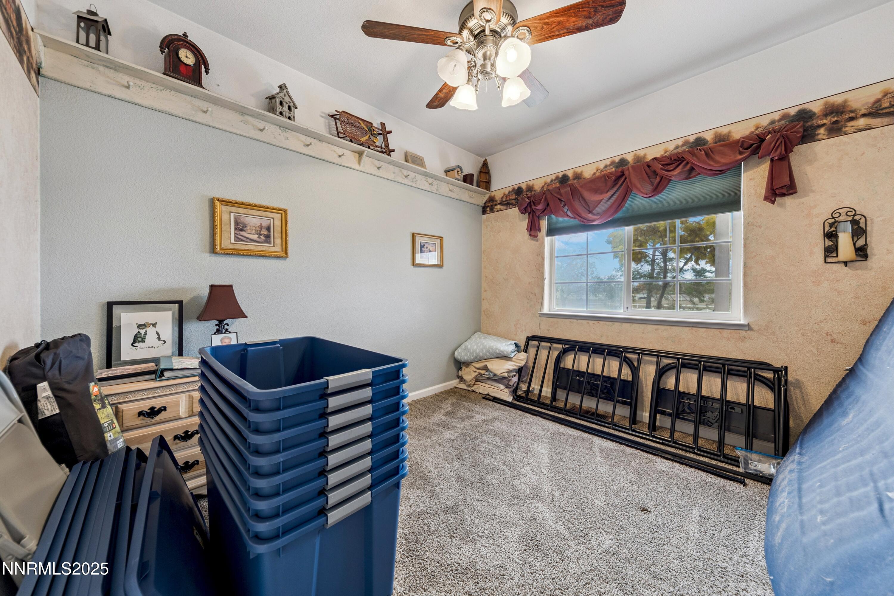 955 Carol Way Fernley, NV 89408 - Photo 32 of 42 a bedroom with furniture and a window