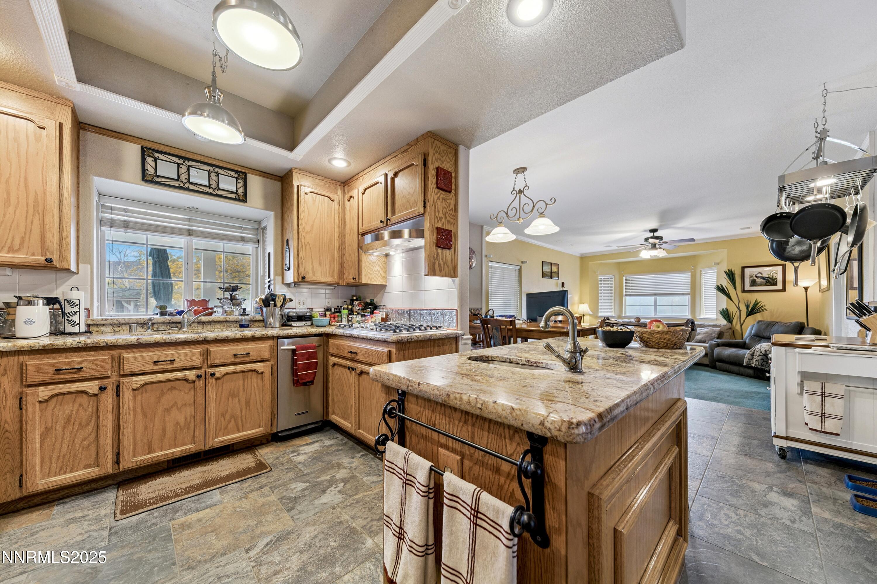 955 Carol Way Fernley, NV 89408 - Photo 4 of 42 a kitchen with sink stove and cabinets