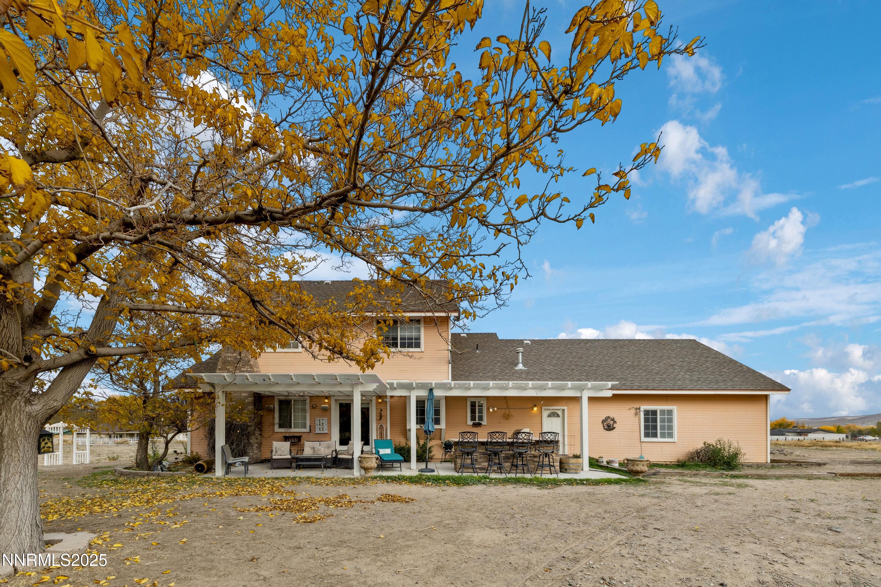 955 Carol Way Fernley, NV 89408 - Photo 6 of 42 front view of a house with a tree