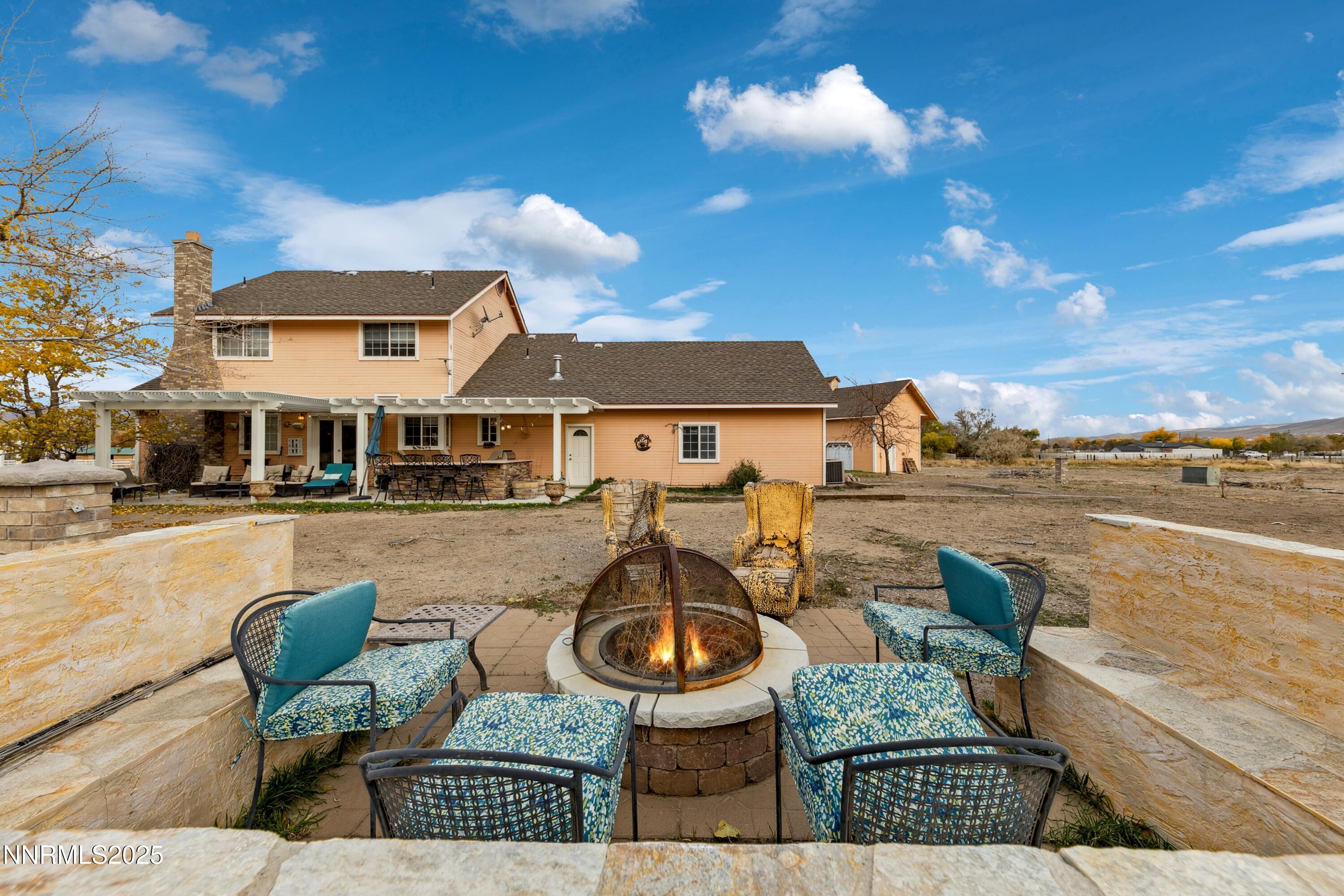 955 Carol Way Fernley, NV 89408 - Photo 8 of 42 a view of a house with swimming pool and patio