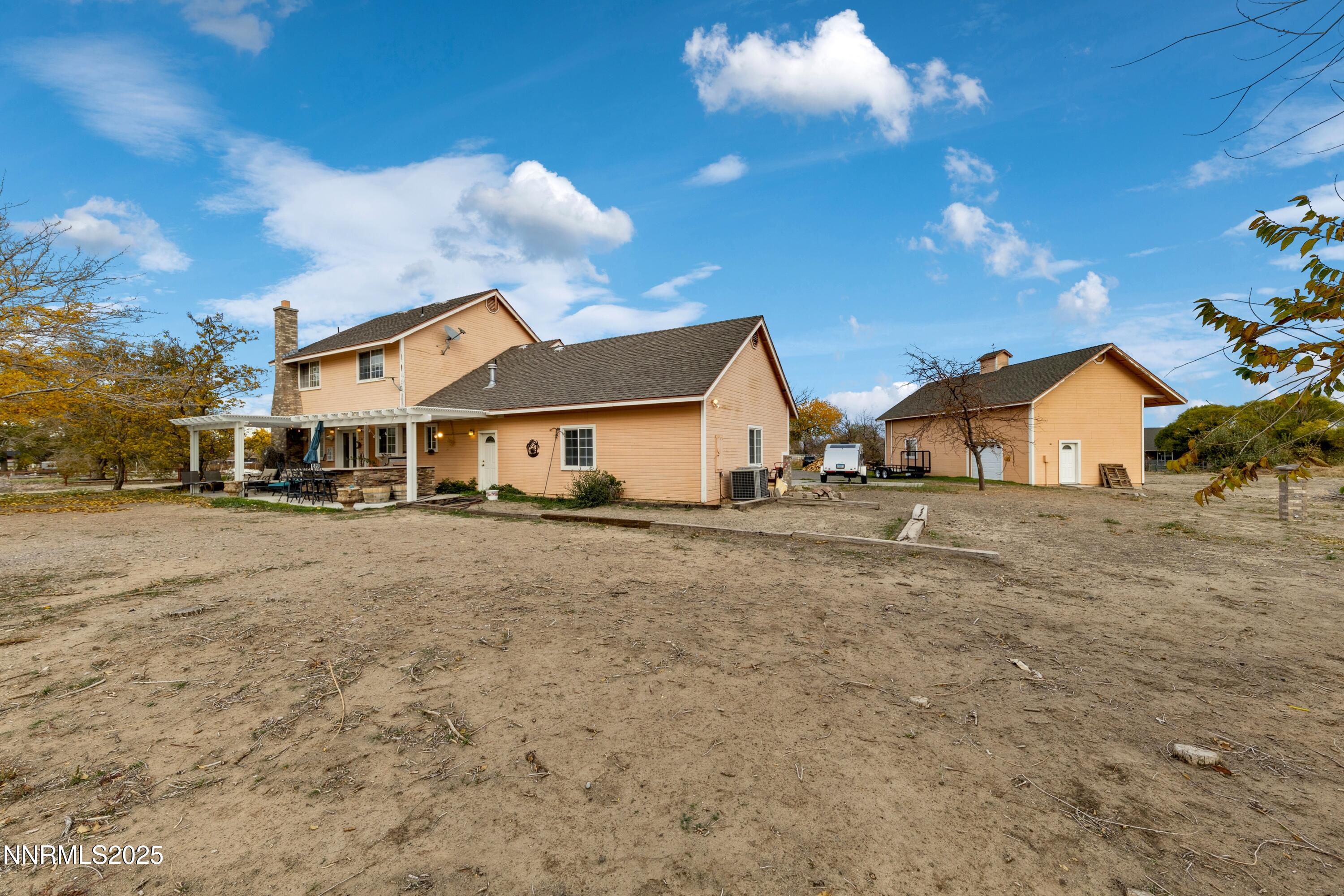 955 Carol Way Fernley, NV 89408 - Photo 9 of 42 a front view of a house with a yard