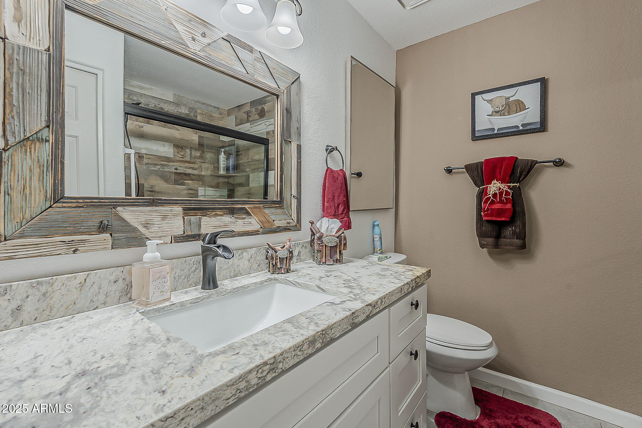 15205 North Ivory Drive, Unit B Fountain Hills, AZ 85268 - Photo 16 of 41 a bathroom with a granite countertop double vanity sink and a mirror