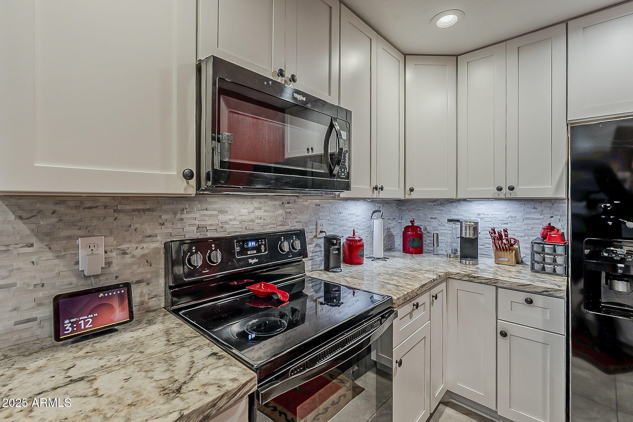 15205 North Ivory Drive, Unit B Fountain Hills, AZ 85268 - Photo 2 of 41 a kitchen with stainless steel appliances granite countertop a stove microwave and sink