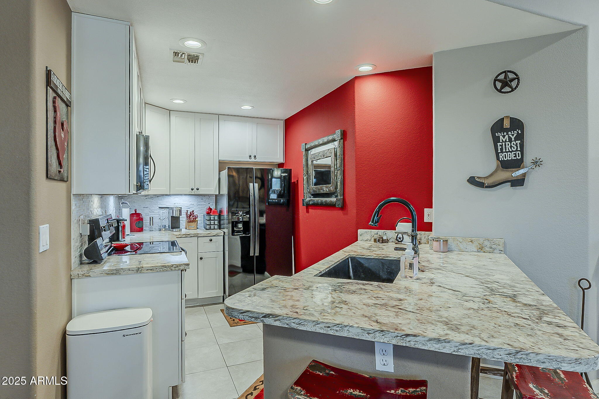 15205 North Ivory Drive, Unit B Fountain Hills, AZ 85268 - Photo 27 of 41 a kitchen with stainless steel appliances granite countertop a sink refrigerator and stove