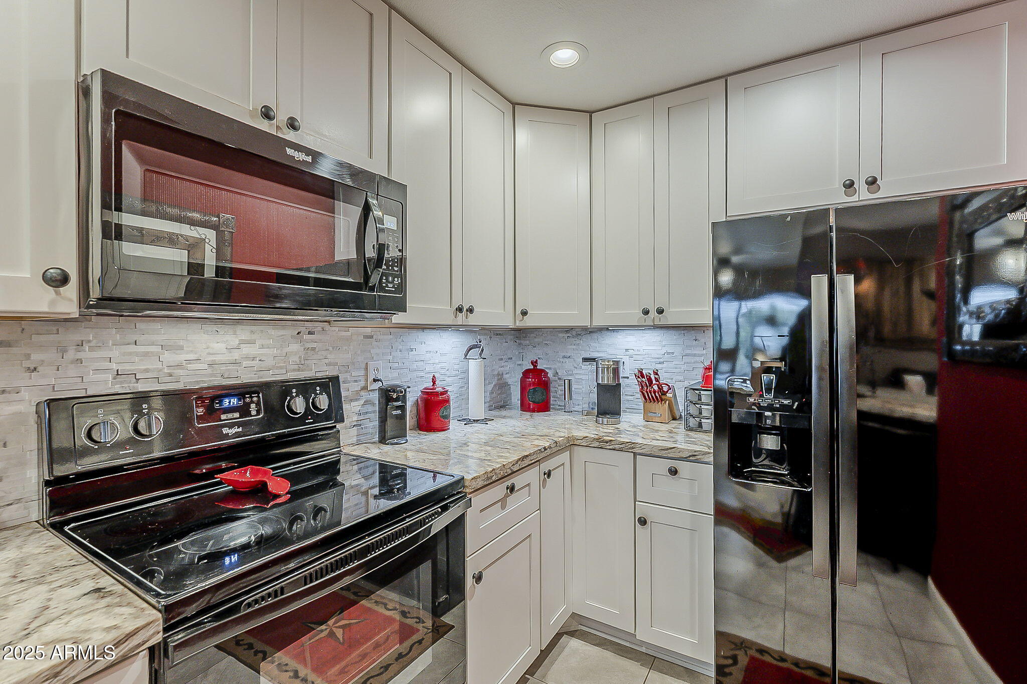 15205 North Ivory Drive, Unit B Fountain Hills, AZ 85268 - Photo 28 of 41 a kitchen with stainless steel appliances granite countertop a stove and cabinets