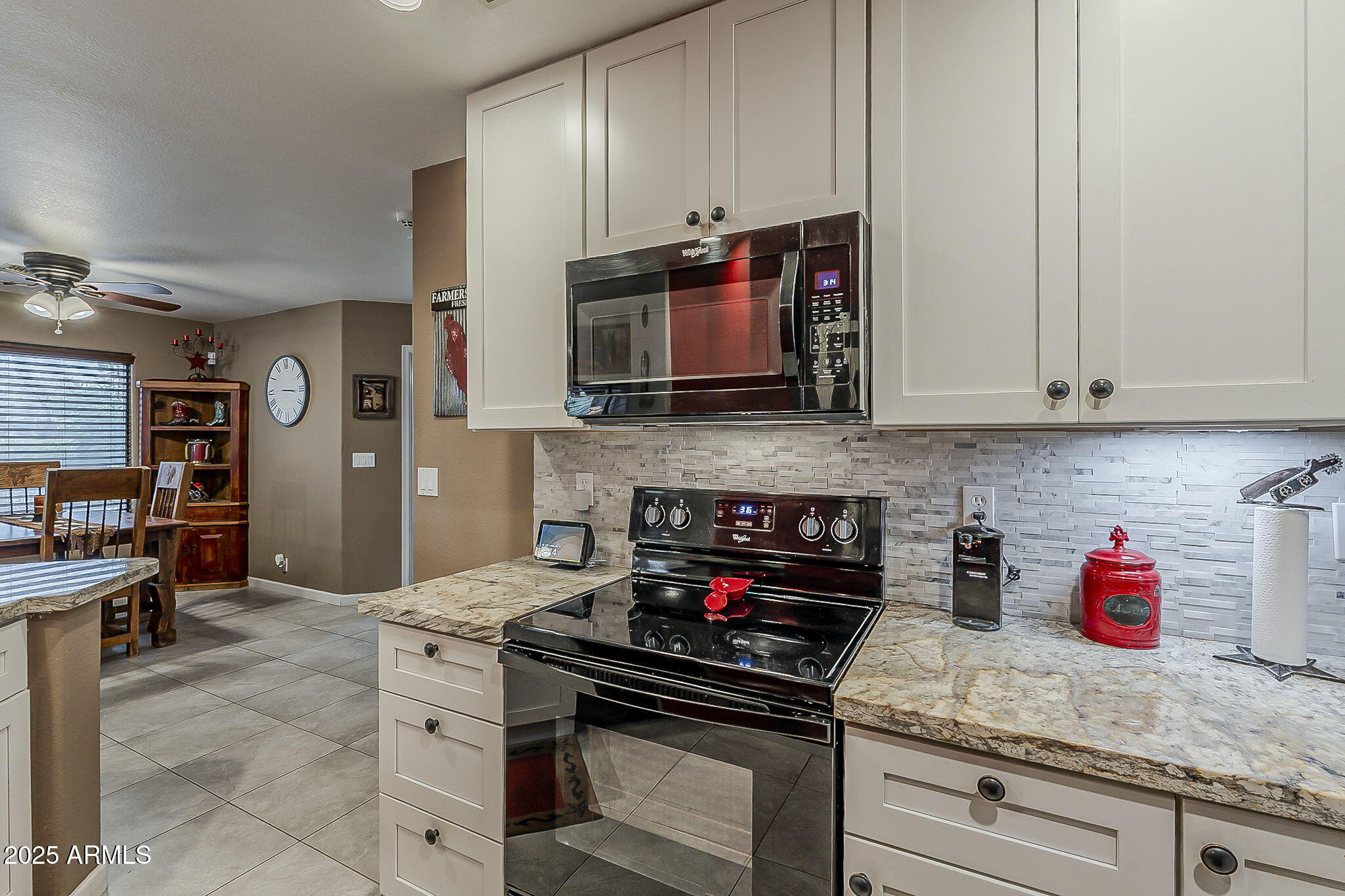 15205 North Ivory Drive, Unit B Fountain Hills, AZ 85268 - Photo 29 of 41 a kitchen with stainless steel appliances granite countertop a stove a microwave and cabinets