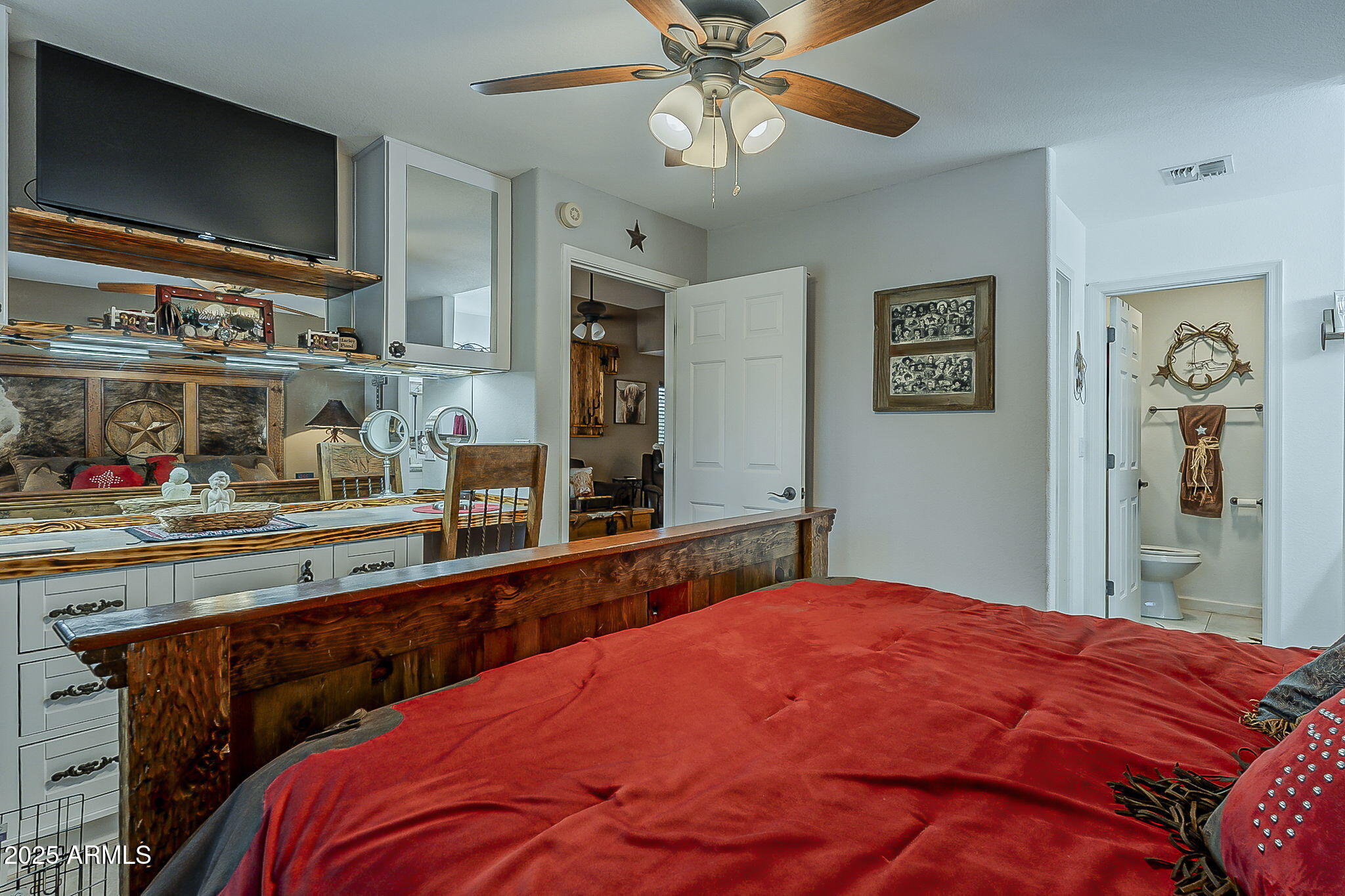 15205 North Ivory Drive, Unit B Fountain Hills, AZ 85268 - Photo 32 of 41 a bedroom with a bed and a flat tv screen on dresser
