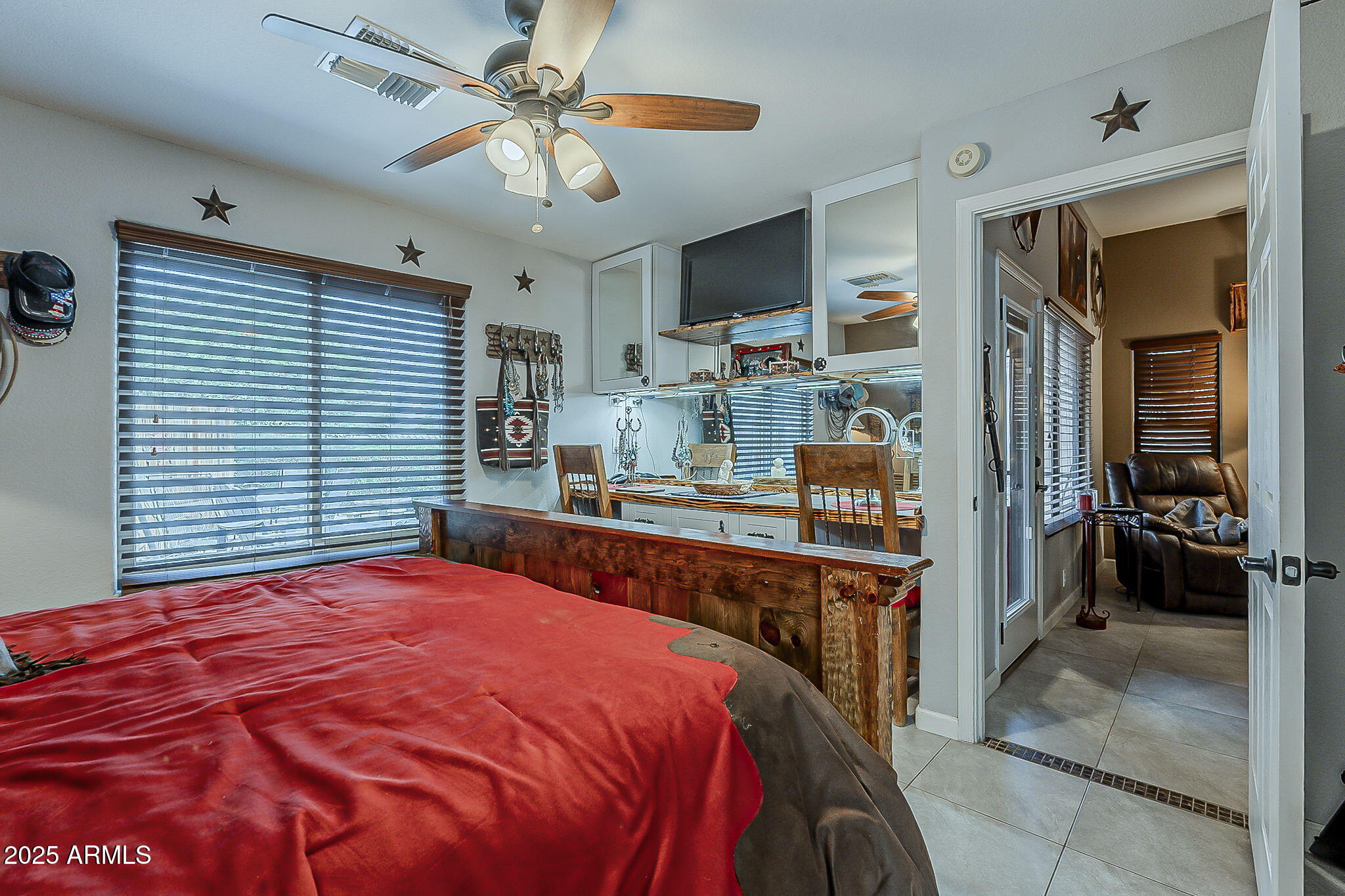 15205 North Ivory Drive, Unit B Fountain Hills, AZ 85268 - Photo 33 of 41 a bedroom with a bed and a chandelier