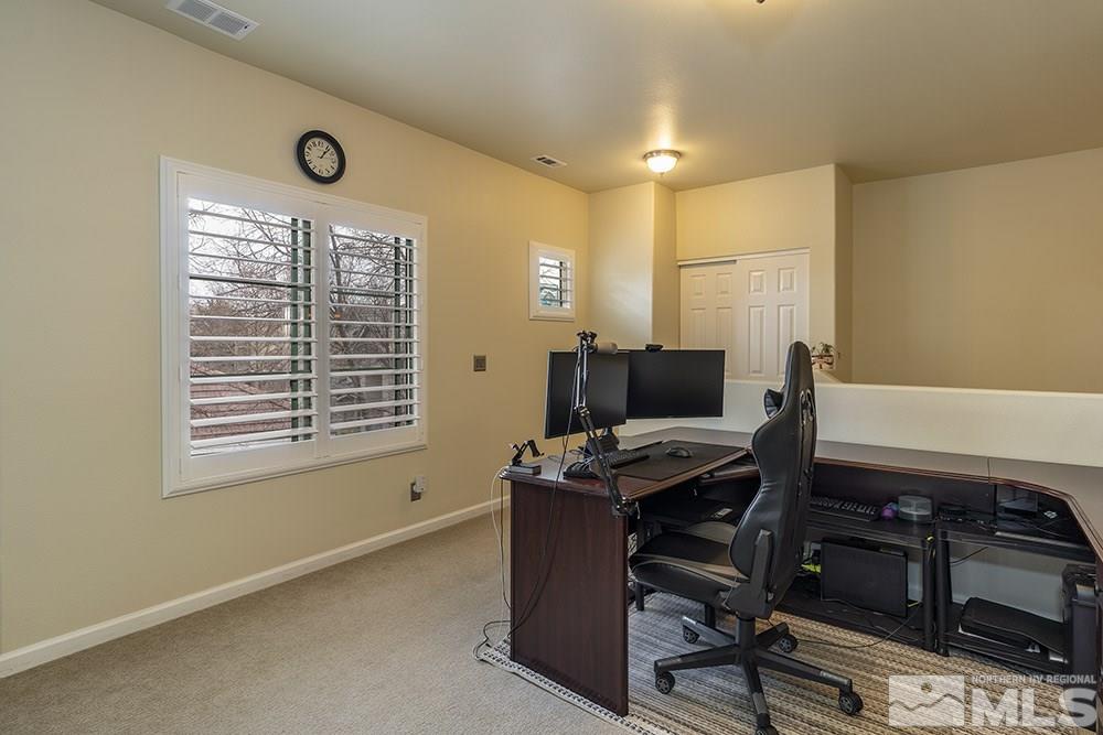 900 South, Unit 1424 Reno, NV 89521 - Photo 11 of 24 a view of a workspace with furniture and a window