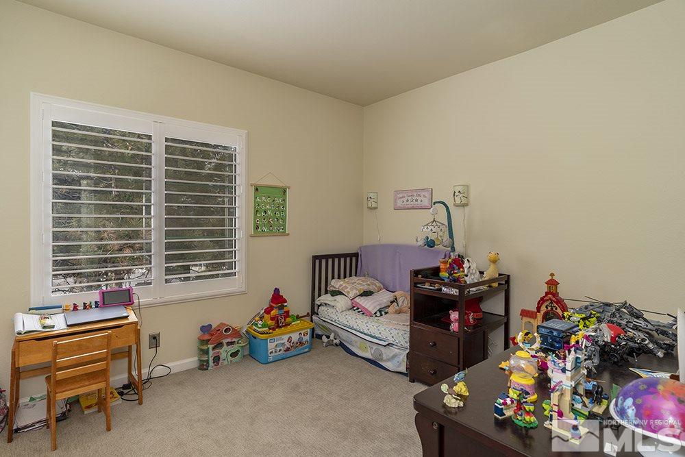 900 South, Unit 1424 Reno, NV 89521 - Photo 15 of 24 a bedroom with furniture and a window