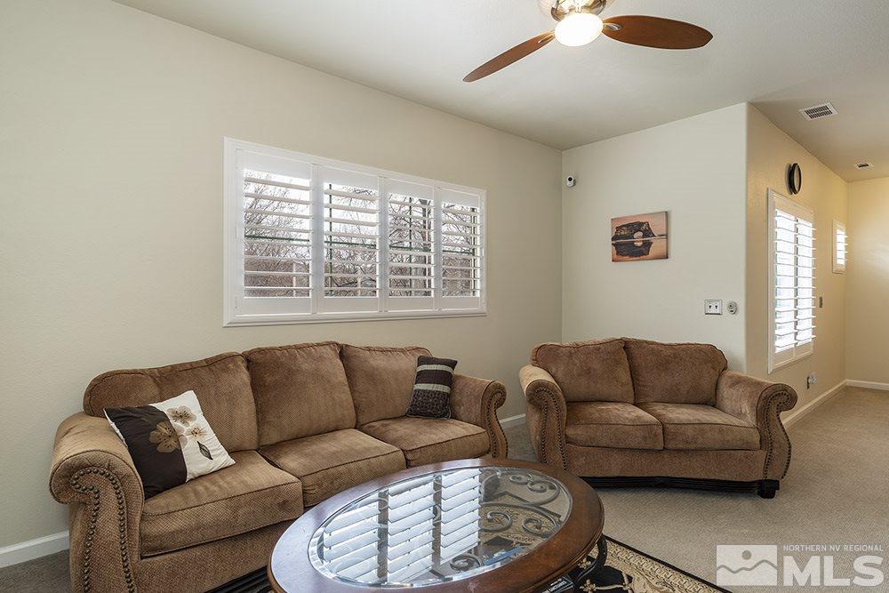 900 South, Unit 1424 Reno, NV 89521 - Photo 4 of 24 a living room with furniture a couch and a window