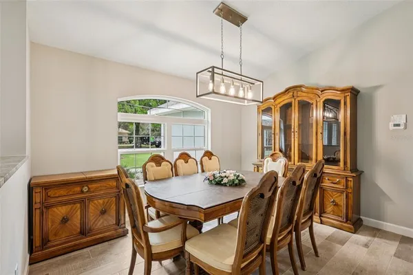 a kitchen with stainless steel appliances granite countertop a refrigerator a stove and a sink