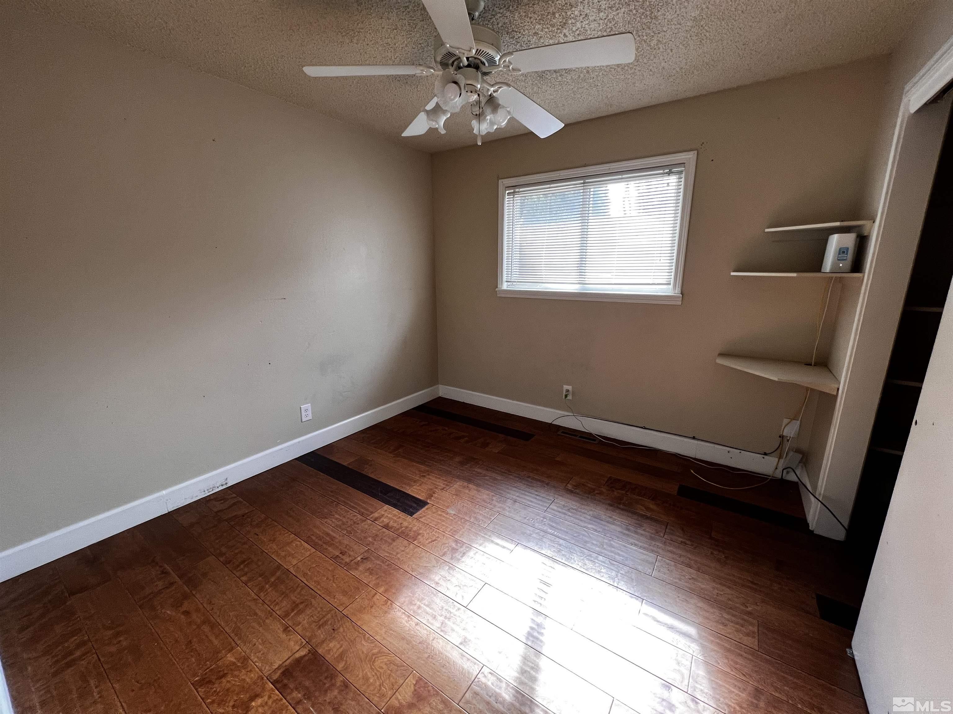 908 Lester Avenue Reno, NV 89502 - Photo 18 of 35 a view of room with window and ceiling fan