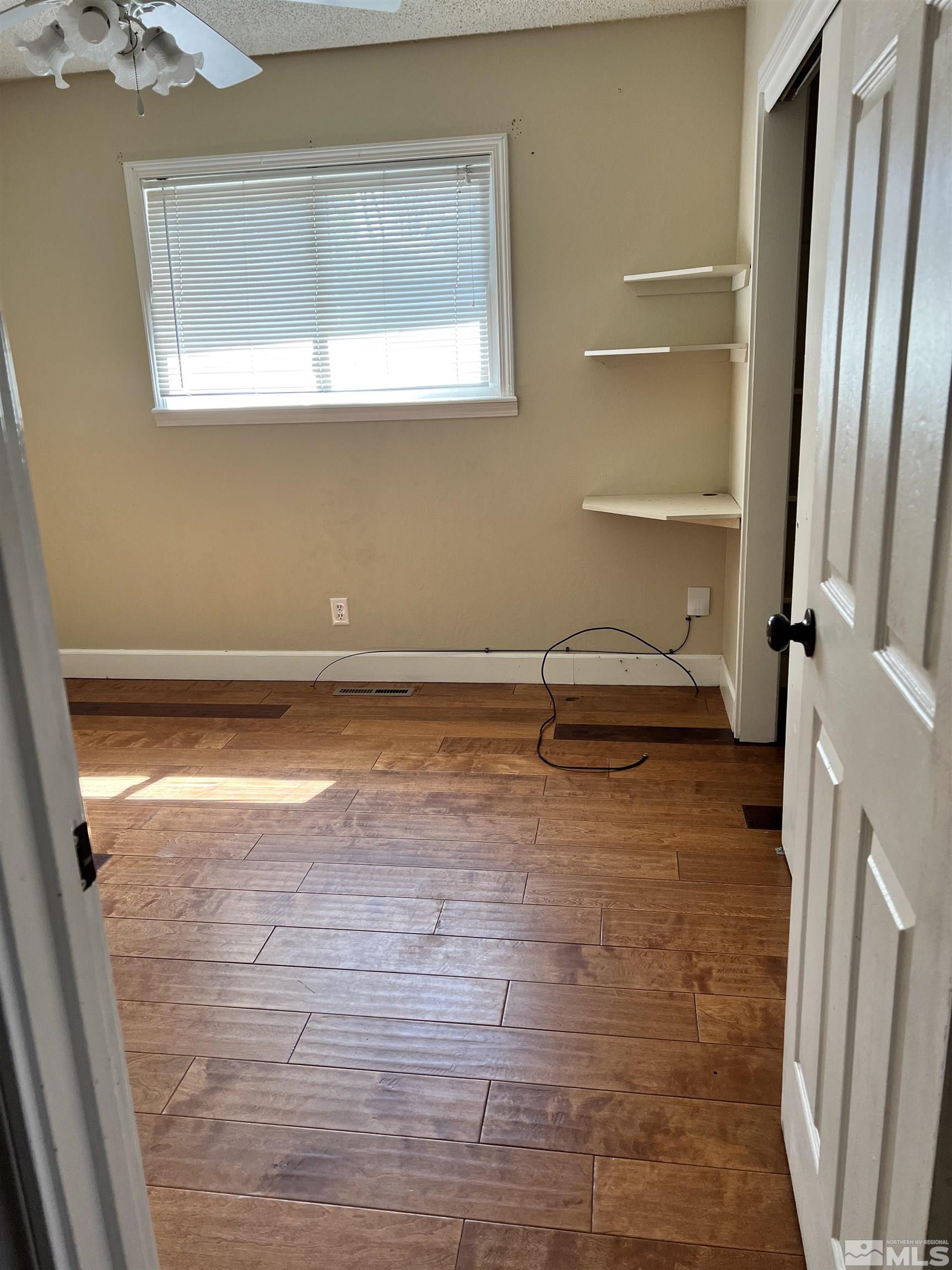 908 Lester Avenue Reno, NV 89502 - Photo 29 of 35 a view of an empty room with a window