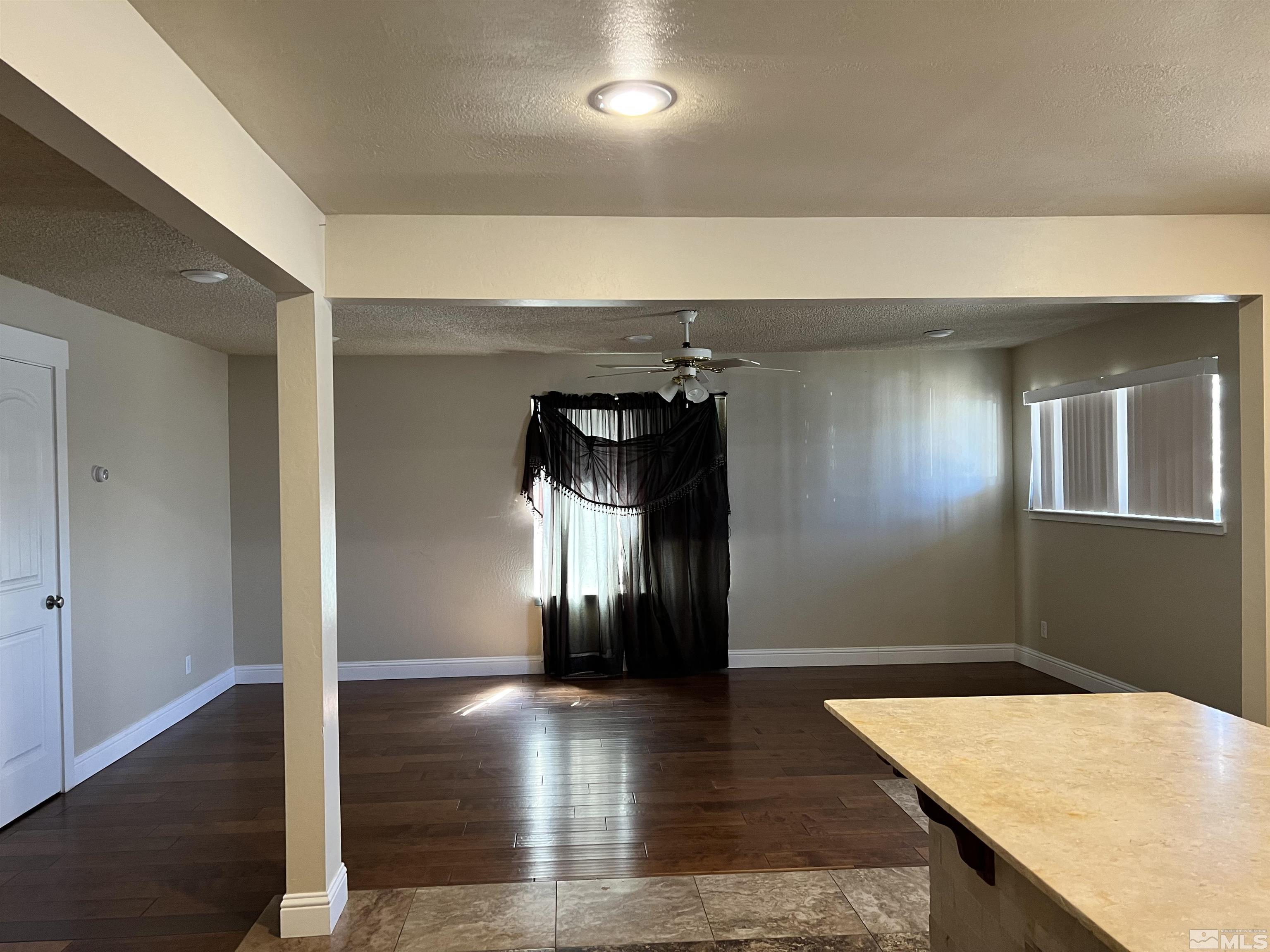 908 Lester Avenue Reno, NV 89502 - Photo 6 of 35 wooden floor in a hall with a window