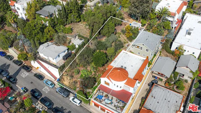 an aerial view of a residential apartment building with a yard